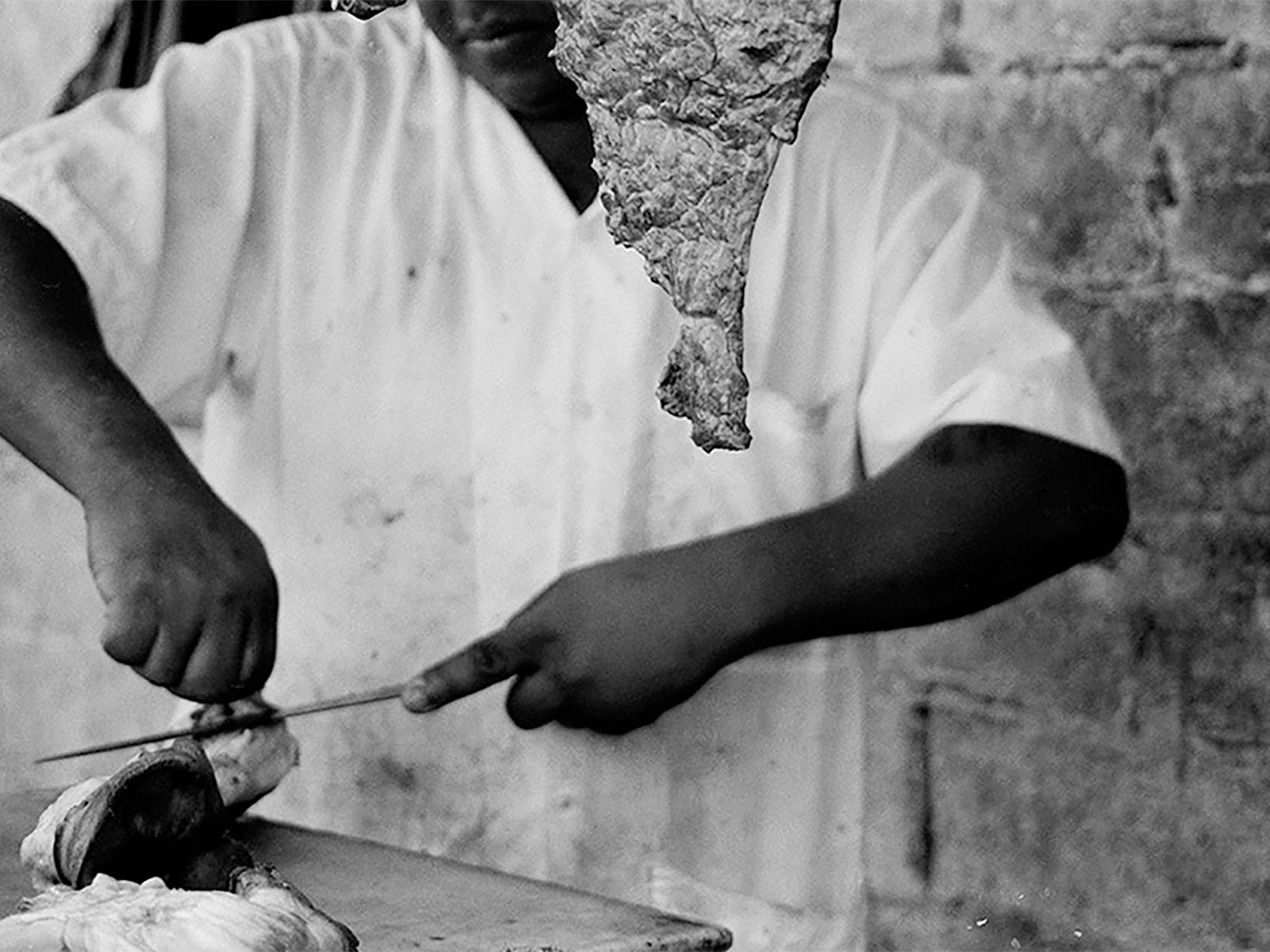 Butcher cutting Meat