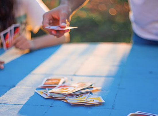 People playing Uno, a board game