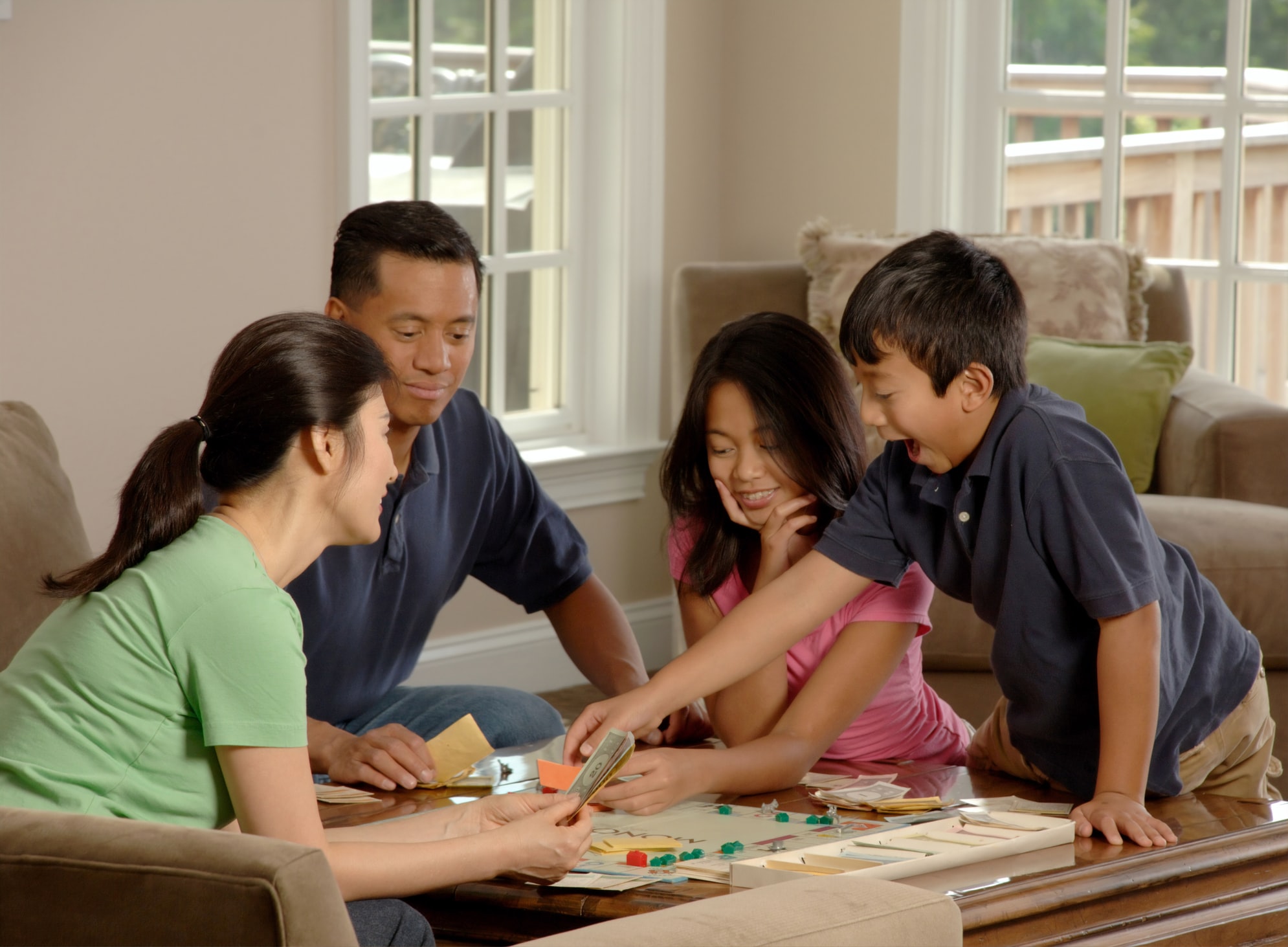 Family playing a board game