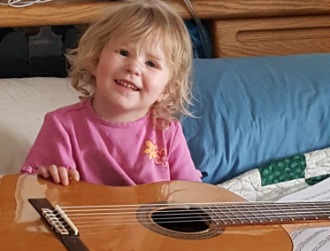 Toddler Ellie with guitar