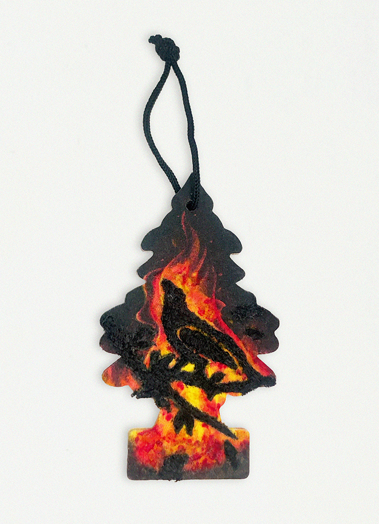 an embroidered car air freshener of a bird on a branch with printed fire on the car air freshener.