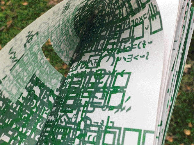 The inner fold of the front cover, photographed in front of a lawn with fallen leaves: unknown glyphs and diacritics spill out from the gutter in varying shades of green.