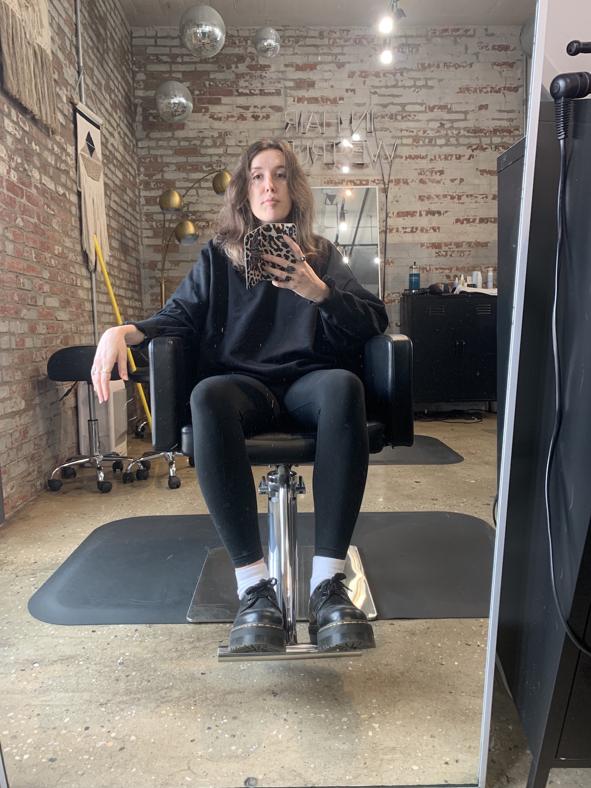 mirror selfie of me in a salon chair with long hair nearly down to my tits