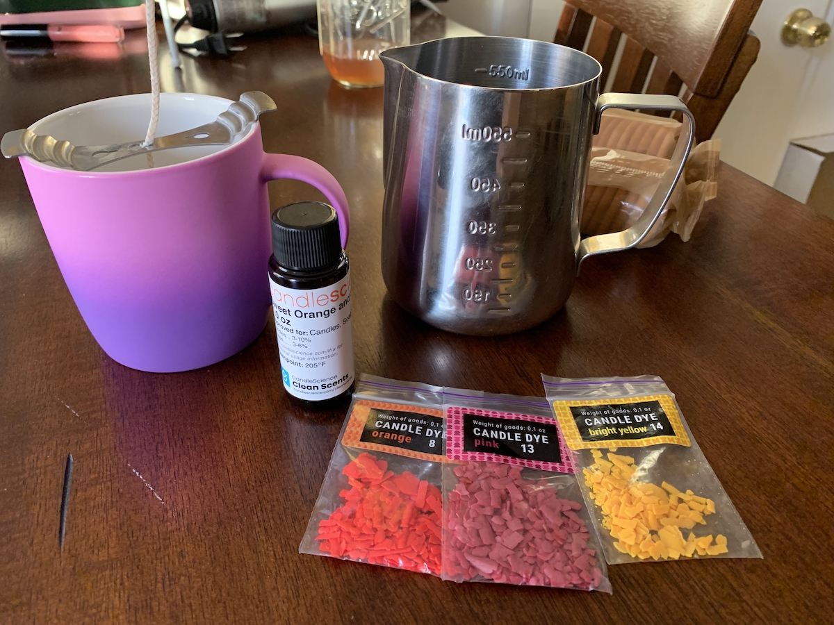 photo of candle supplies on my counter with a beautiful purple/pink ombre mug